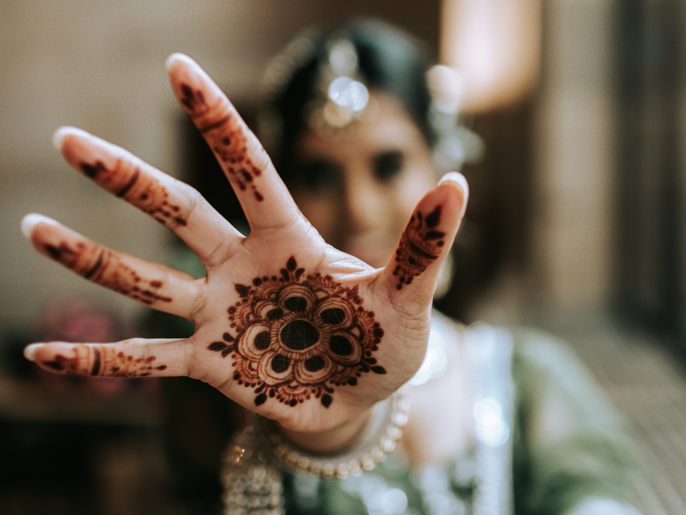 The Residence Zanzibar — shaded hotel grounds for a henna session